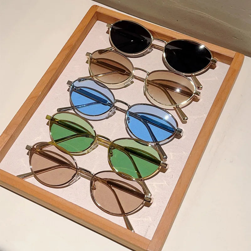 Oval Sunglasses Featuring Sculpted Brushed Metal Frames