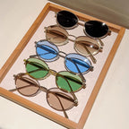 Oval Sunglasses Featuring Sculpted Brushed Metal Frames
