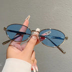 Oval Sunglasses Featuring Sculpted Brushed Metal Frames