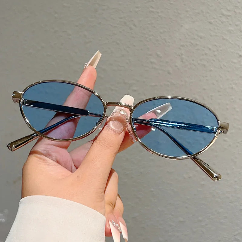Oval Sunglasses Featuring Sculpted Brushed Metal Frames
