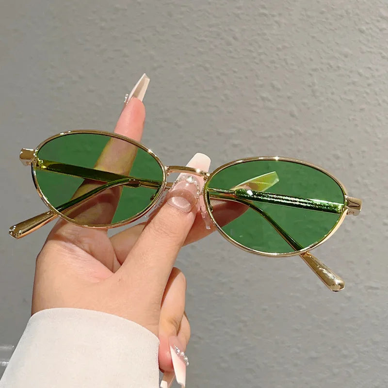 Oval Sunglasses Featuring Sculpted Brushed Metal Frames
