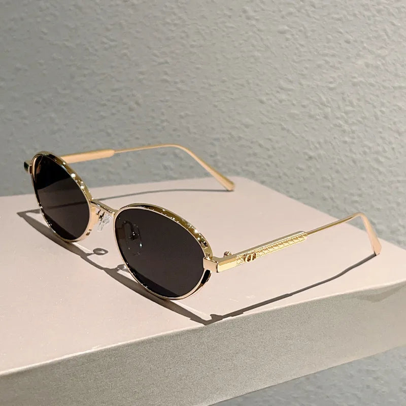Oval Sunglasses Featuring Sculpted Brushed Metal Frames